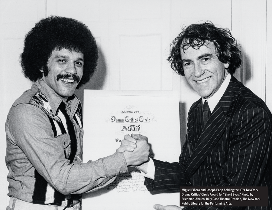 Miguel Piñero and Joseph Papp holding the 1974 New York Drama Critics' Circle Award for "Short Eyes." Photo by Friedman-Abeles, Billy Rose Theatre Division, The New York Public Library for the Performing Arts.